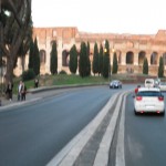 Colosseum from afar by evening - Look!  I found it!  But it's a little fuzzy given my perch on a narrow median...